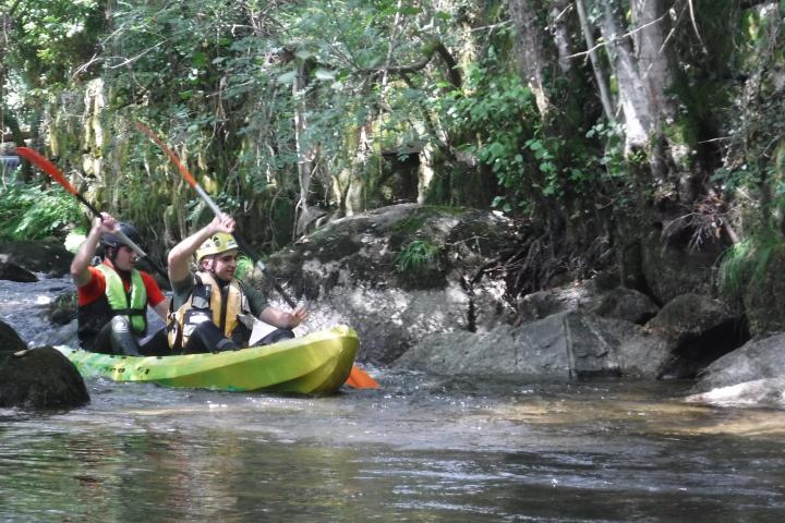 a group of people riding on the back of a boat