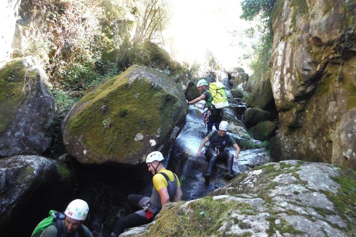 a group of people on a rock